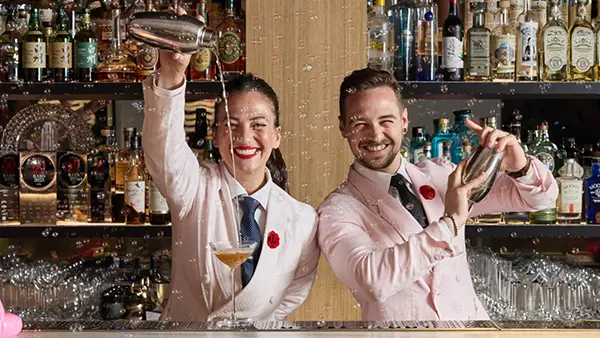 Maybe Sammy bartenders shaking cocktails at award-winning Sydney cocktail bar — hospitality consulting partner.